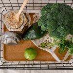A basket of fresh produce and oats promoting a healthy and sustainable lifestyle.